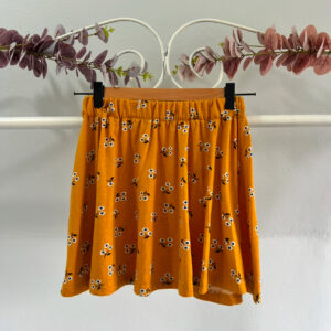 thrifted mini mustard skirt with flowers